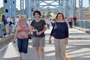 Robin with her friends on a bridge